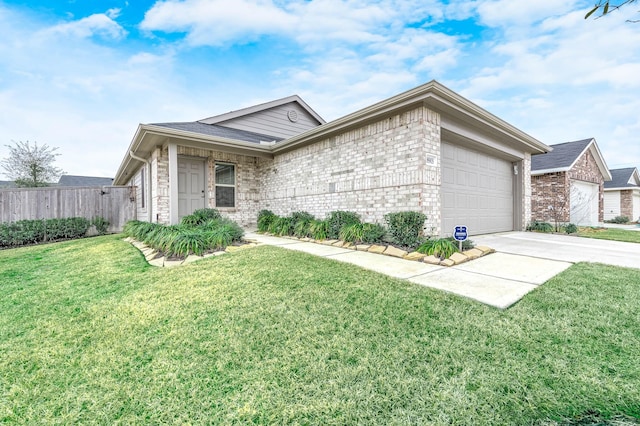 ranch-style home with a garage and a front yard