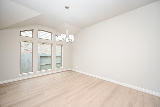 unfurnished dining area featuring a notable chandelier, light hardwood / wood-style flooring, and vaulted ceiling