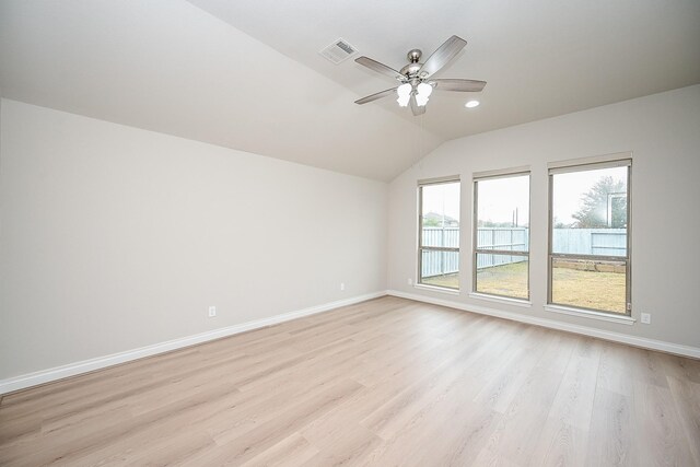 unfurnished room featuring ceiling fan, vaulted ceiling, and light hardwood / wood-style flooring