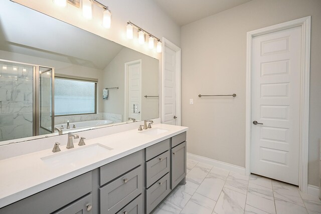 bathroom with a shower with door, vanity, and lofted ceiling