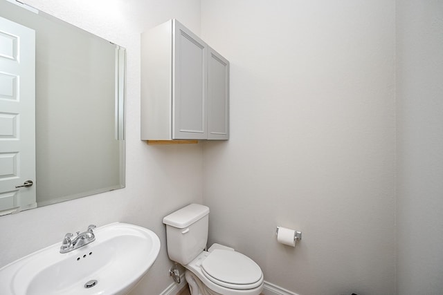 bathroom with sink and toilet