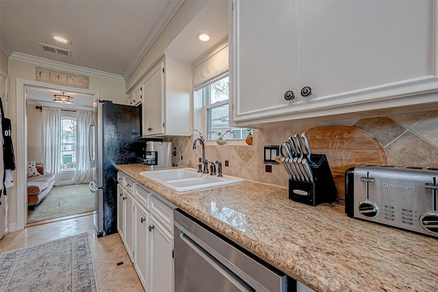 kitchen featuring sink, ornamental molding, dishwasher, white cabinets, and backsplash