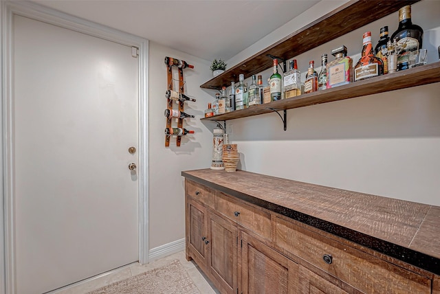 bar with light tile patterned flooring