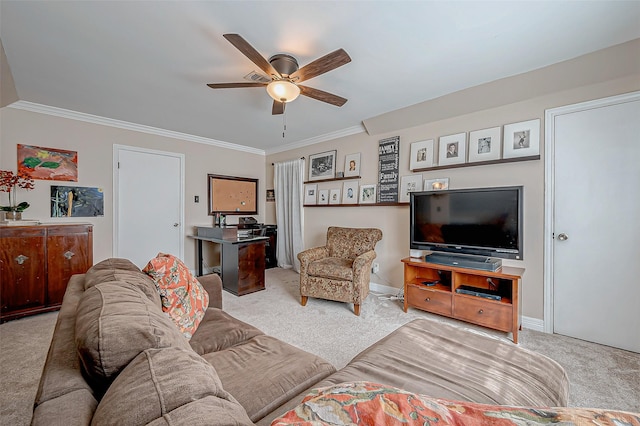 living room featuring ceiling fan, light colored carpet, and ornamental molding