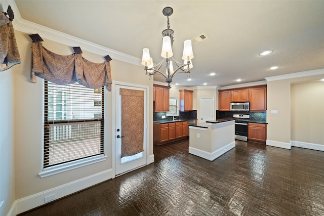 kitchen featuring stainless steel appliances, a center island, decorative backsplash, and plenty of natural light