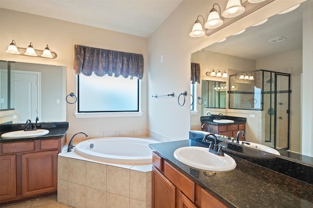 bathroom with vanity, tile patterned flooring, and separate shower and tub