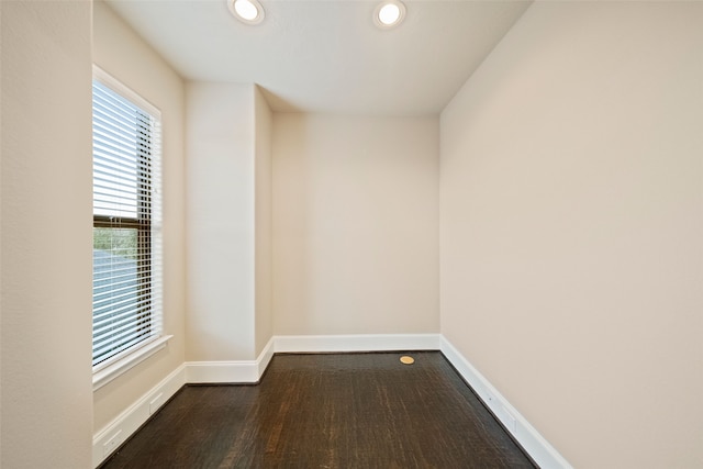 spare room featuring dark hardwood / wood-style flooring