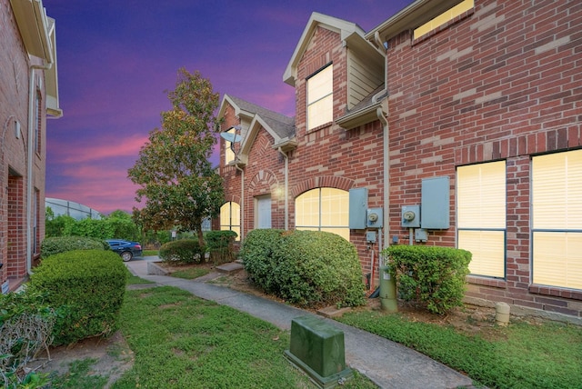 view of property exterior at dusk