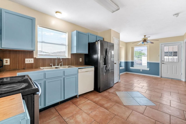 kitchen featuring blue cabinetry, sink, fridge with ice dispenser, white dishwasher, and ceiling fan