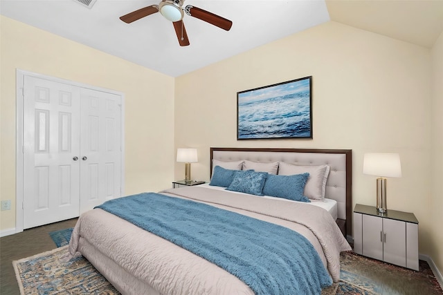 bedroom featuring vaulted ceiling, a closet, and ceiling fan