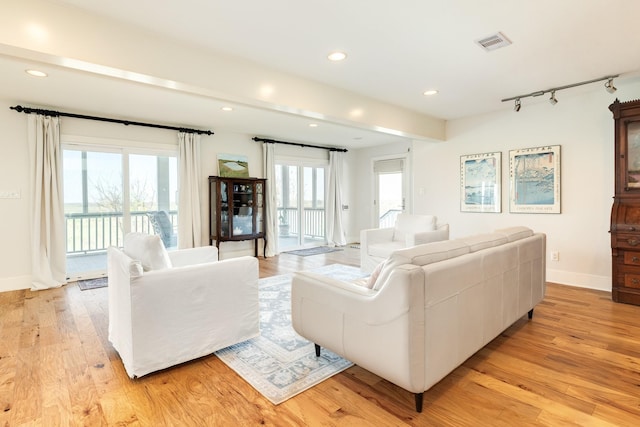 living room with light hardwood / wood-style flooring