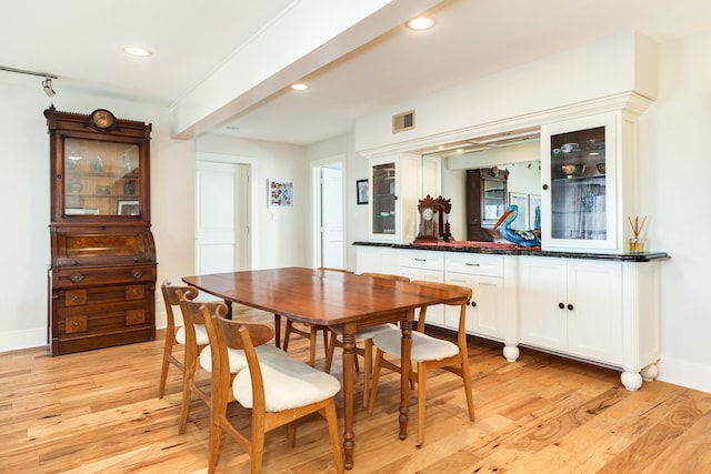 dining space featuring light hardwood / wood-style floors