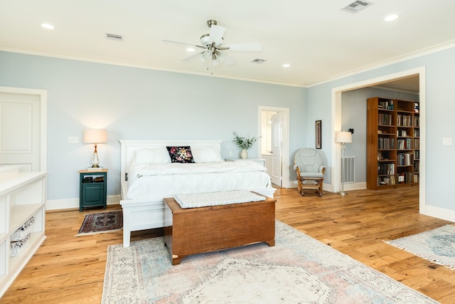 bedroom with ornamental molding, light hardwood / wood-style floors, and ceiling fan