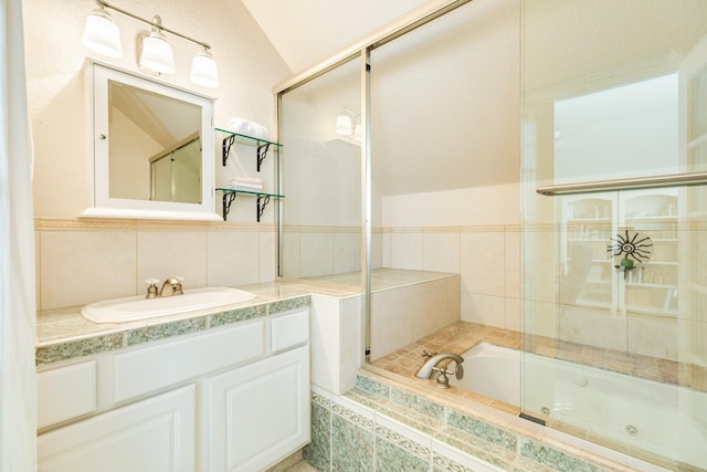 bathroom with vanity and tile walls