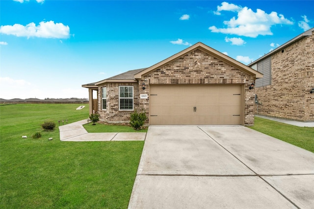 view of front of home with a garage and a front lawn