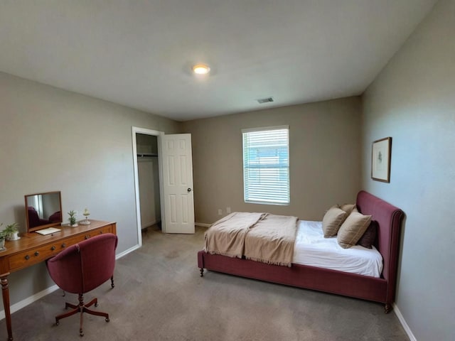 carpeted bedroom with baseboards and visible vents