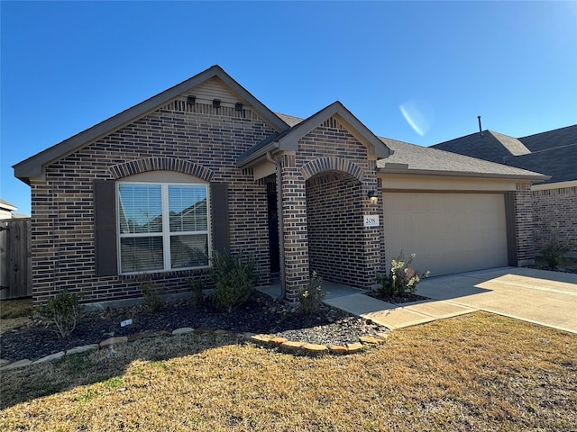 view of front of house with a garage and a front yard