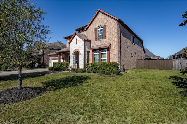 view of front facade featuring a garage and a front lawn