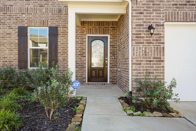 entrance to property featuring a garage