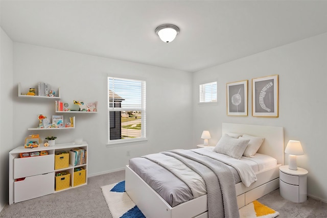 bedroom featuring light carpet