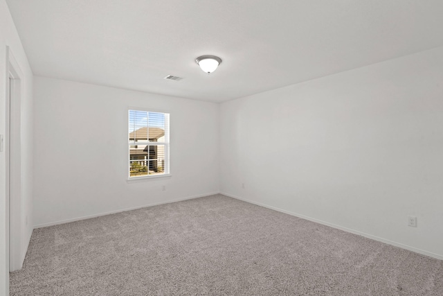 empty room featuring carpet floors