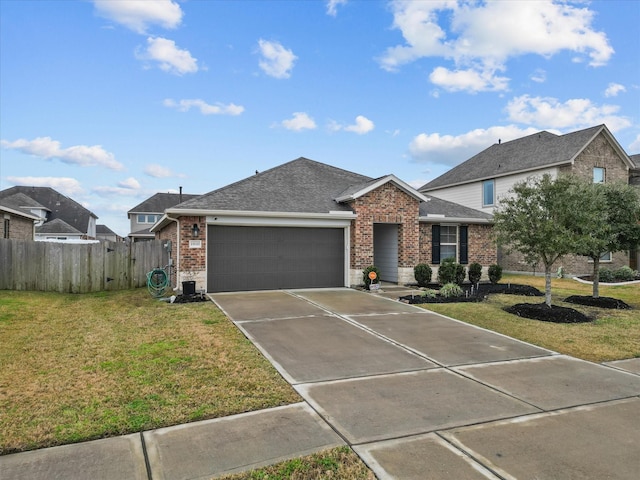 view of front of house with a garage and a front yard