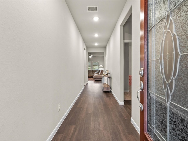 hallway with dark wood-type flooring