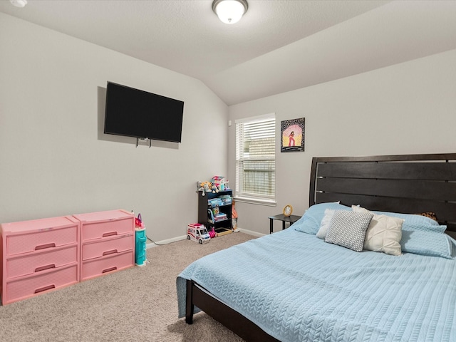 carpeted bedroom featuring lofted ceiling