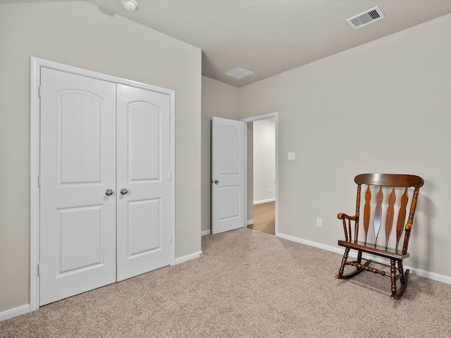 living area featuring carpet floors