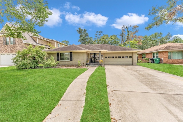 single story home with a garage and a front lawn