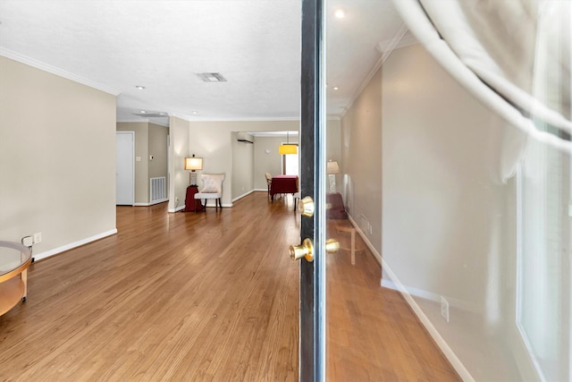 hall featuring ornamental molding and wood-type flooring