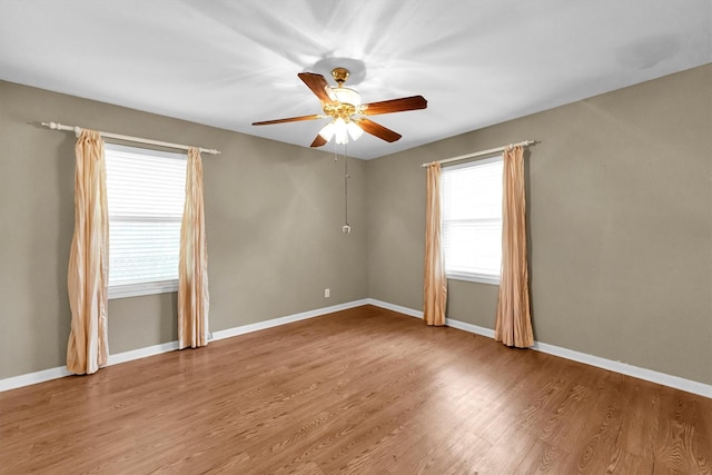 unfurnished room with wood-type flooring and ceiling fan