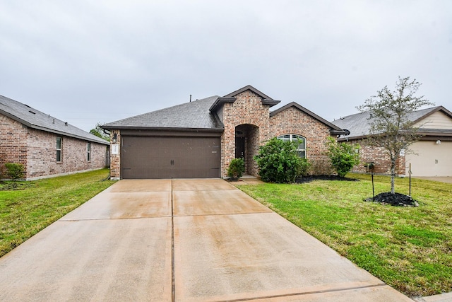 view of front of home featuring a garage and a front yard