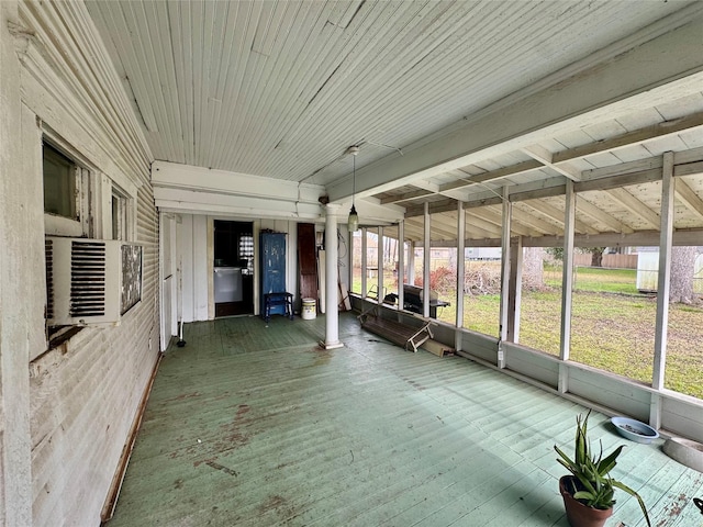 unfurnished sunroom with wood ceiling and a wealth of natural light