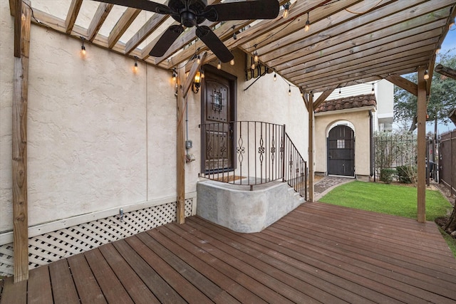 wooden deck featuring ceiling fan