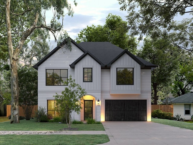 modern inspired farmhouse featuring a garage and a front yard