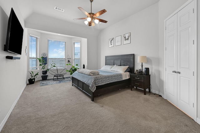 carpeted bedroom with lofted ceiling and ceiling fan