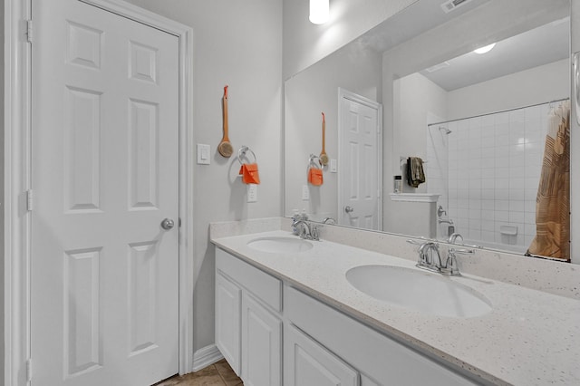 bathroom featuring vanity, tile patterned flooring, and shower / bath combination with curtain