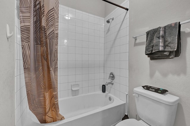 bathroom with shower / bath combination with curtain and toilet