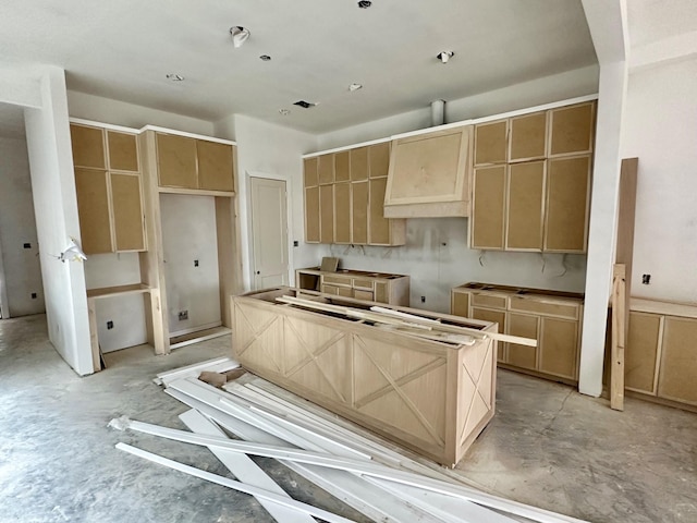 2434 Quenby St, Houston, TX 77005 - kitchen featuring unfinished concrete floors, light brown cabinetry, and a center island