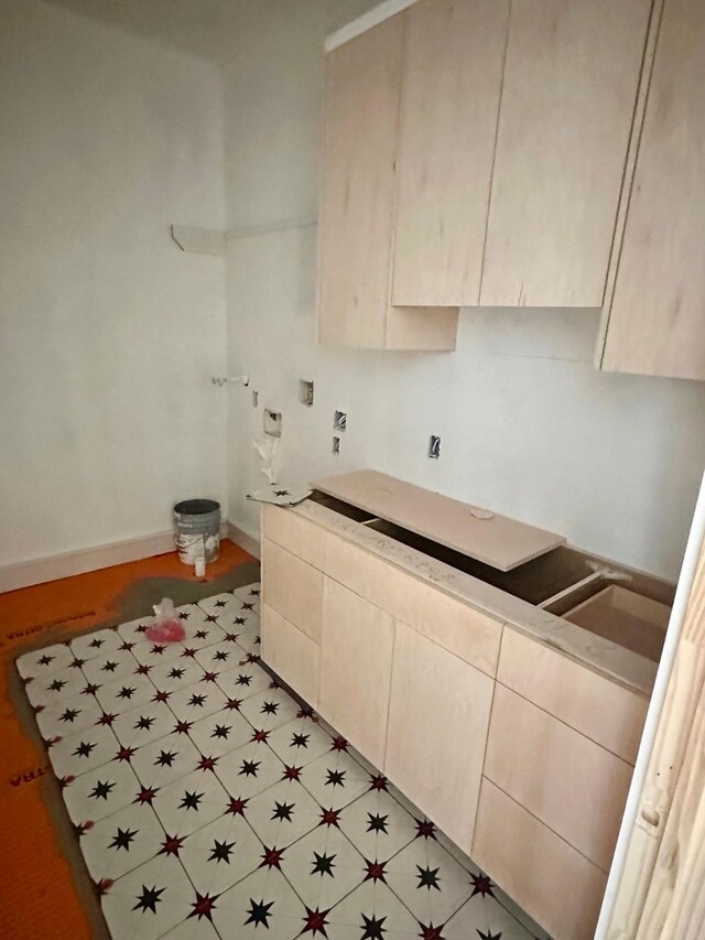 2434 Quenby St, Houston, TX 77005 - kitchen with baseboards and light countertops