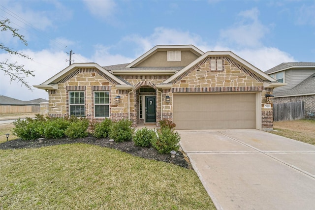 view of front facade with a garage and a front lawn