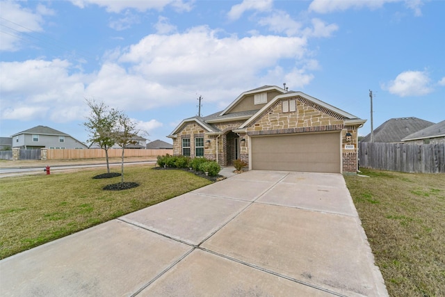 view of front of property featuring a garage and a front lawn