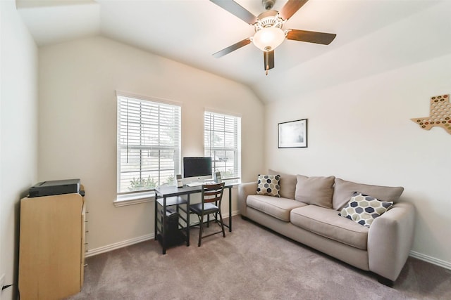 carpeted office space featuring lofted ceiling and ceiling fan