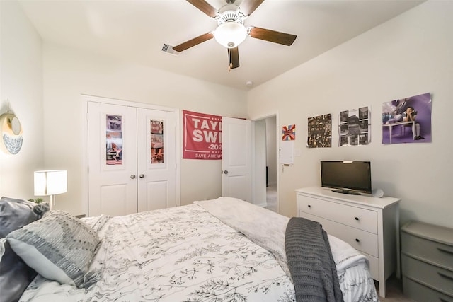 bedroom featuring ceiling fan and a closet