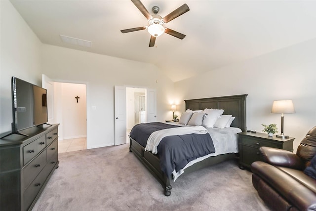 carpeted bedroom featuring ceiling fan and lofted ceiling