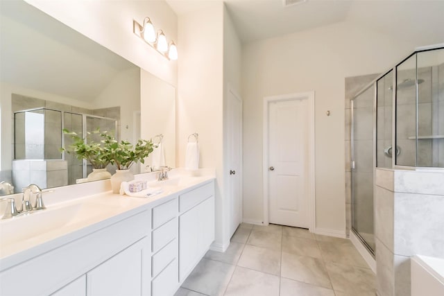 bathroom with lofted ceiling, vanity, and walk in shower