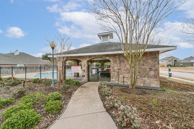 view of home's community with a swimming pool