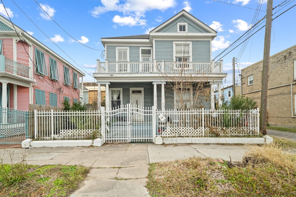 view of front of property with a balcony and covered porch