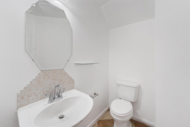 bathroom featuring tile patterned floors, toilet, and sink